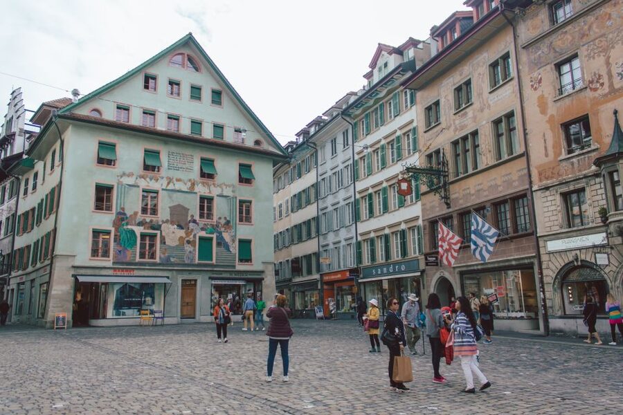 Lucerne: Guided Walking Tour with an Official Guide - How the guide weaves in Spreuer Bridge and the Museggmauer nine-tower story