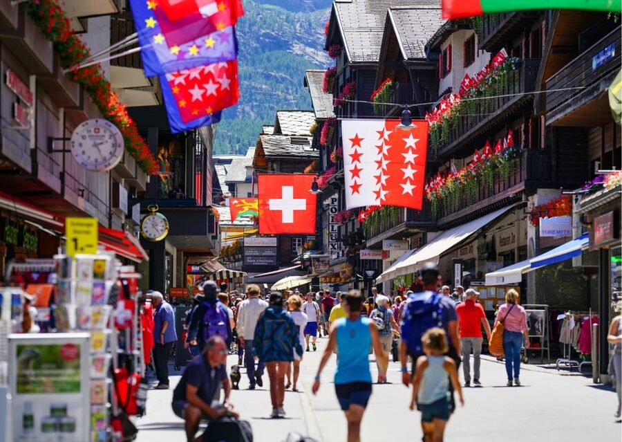 Lucerne: Private Walking Tour with Panoramic Yacht Cruise - The Water Tower stop, and the practical meaning of riverfront buildings