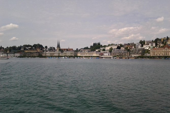 Lucerne small group walking tour and Lake Cruise from Zürich - Hotel des Balances murals and Schwanenplatz, Lucerne’s most photographed waterfront feel