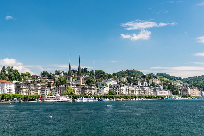 Lucerne Walking Tour and Beer Tasting - Chapel Bridge: covered wooden icon, paintings, and a 1993 fire