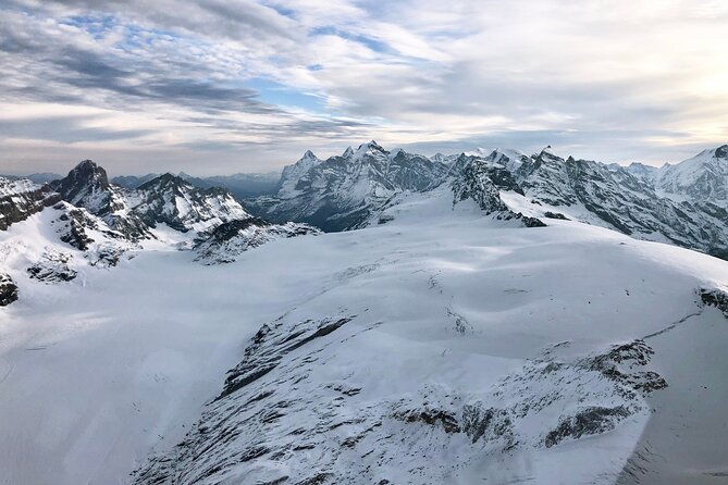 Matterhorn helicopter tour - longest scenic flight from Bern over the Swiss Alps - Stop 2: alpine chain flying, glacier passes, and mountain huts
