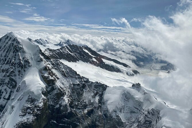 Private Swiss Alps helicopter tour over snow covered mountain peaks and glaciers - Stop 4: Interlaken, Lake Thun, and Lake Brienz From Above