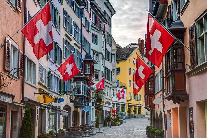 Private Tour of Zurich in 60 minutes with a Local - Stop 5: preserved old-town lanes with pastel shutters and fluttering flags