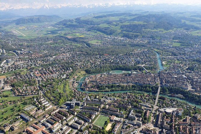 Swiss Capital city helicopter sightseeing tour - the ideal flight to see Berne - Cathedral steeple, Bern’s imposing cathedral scale, and the front park