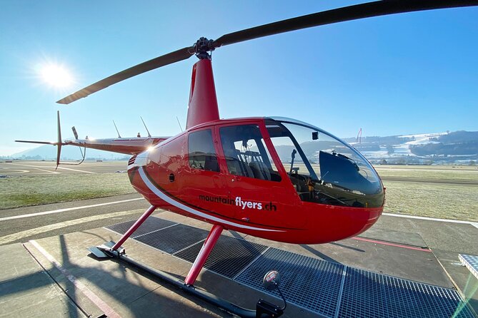Swiss Capital city helicopter sightseeing tour - the ideal flight to see Berne - Football stadium flyover: solar collectors and the Big YB logo