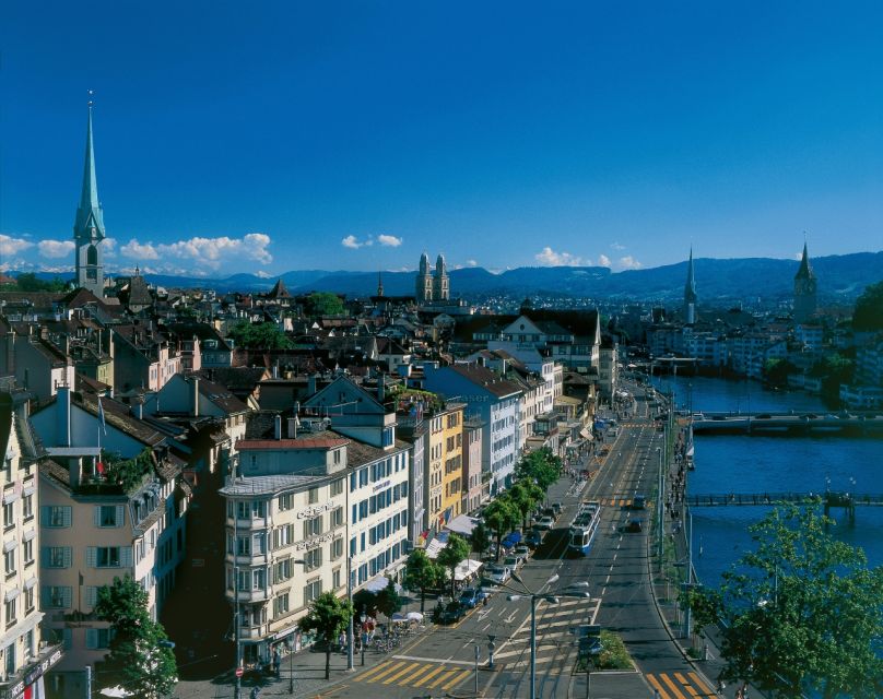 Zurich: Audio Guided City Tour and Train to “Top of Zurich” - Old Town Highlights From the Bus: Churches, Guild Houses, and a Photo Stop