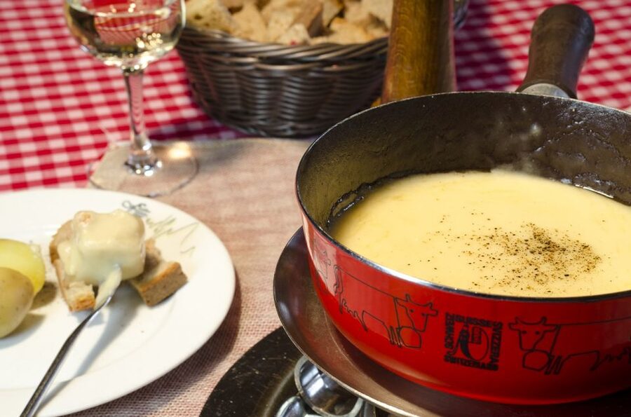 Zurich: Sunset Tour with Cheese Fondue - Lindt Home of Chocolate: Shopping With a Factory Feel